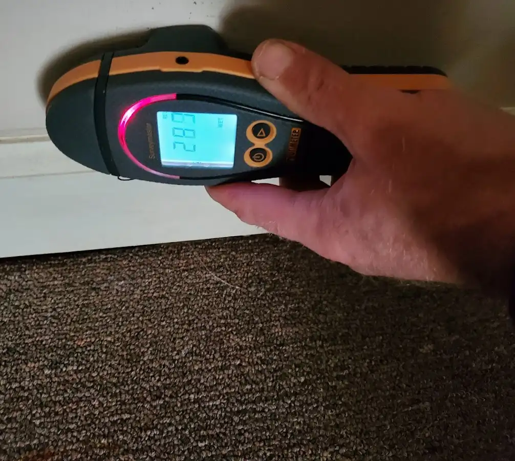 Moisture detection at baseboard during Burst Pipe Cleanup in Barnstable Town